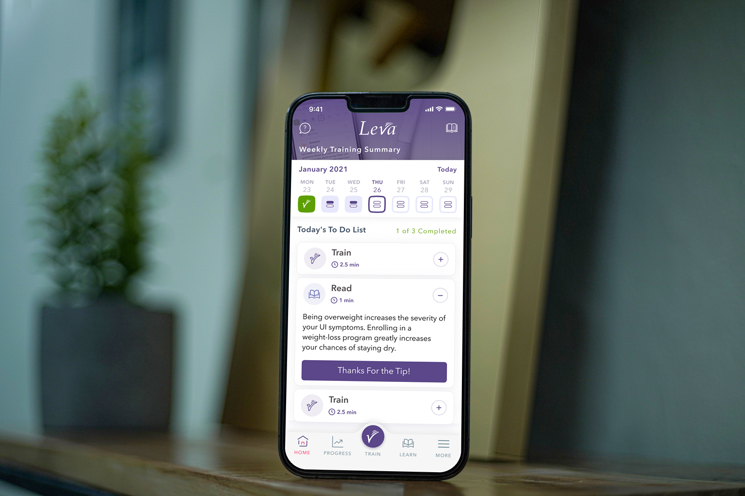 iPhone displaying medical device mobile app with professional interface design